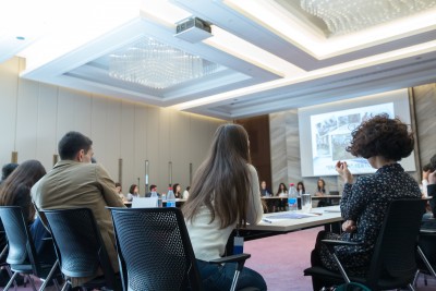 Audience in the conference hall. Business and Entrepreneurship. Panoramic composition suitable for banners. Speaker Giving a Talk at Business Meeting.